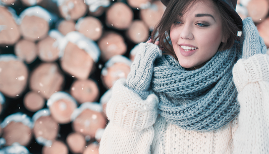 Woman smiling with moisturized lips on snowy day